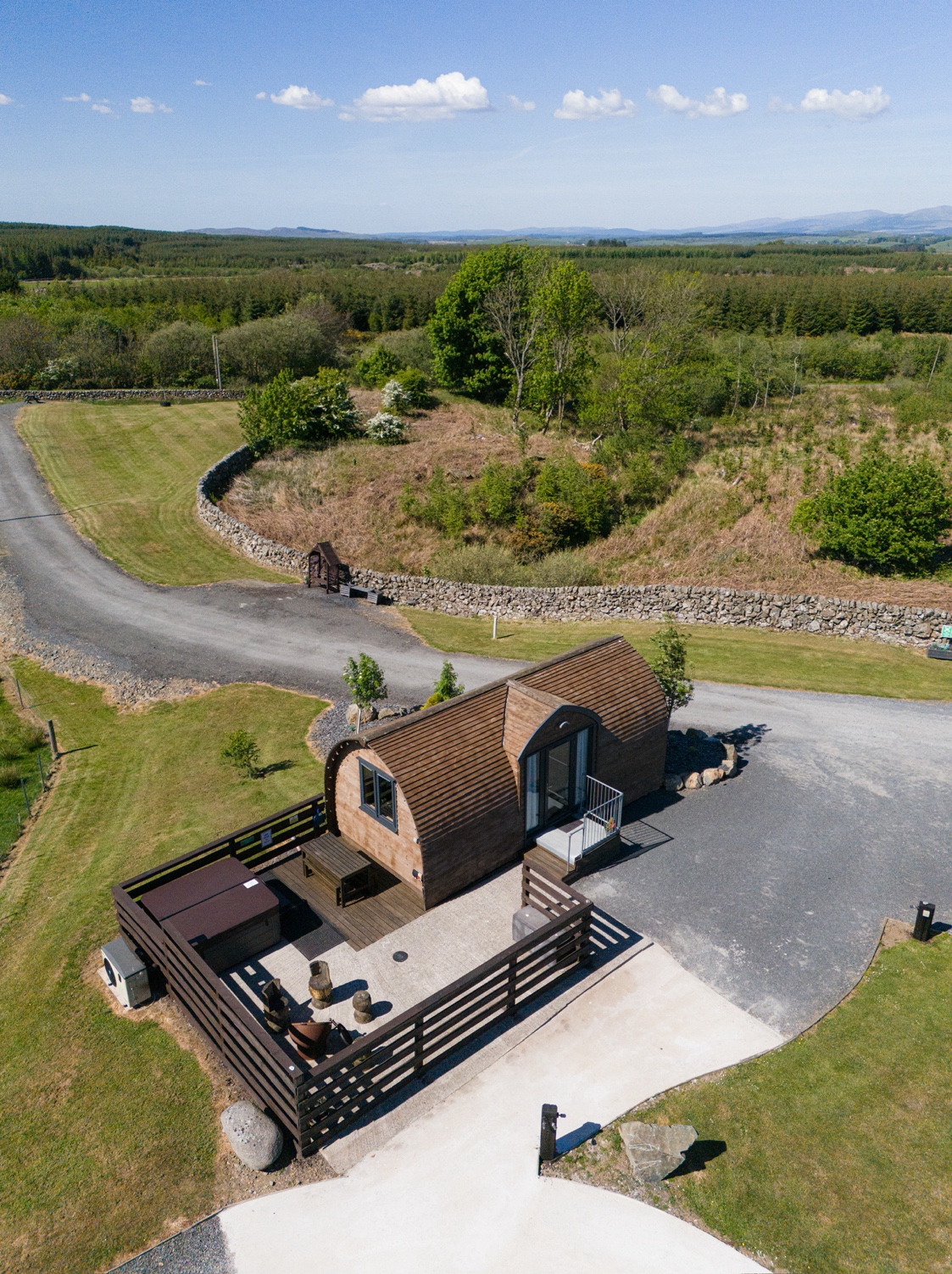 Aerial view of the Superior Large Pod with hot tub and rural views