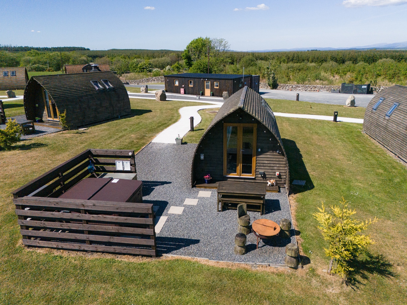 Aerial view of the Superior Pod with private hot tub, fire pit and terrace
